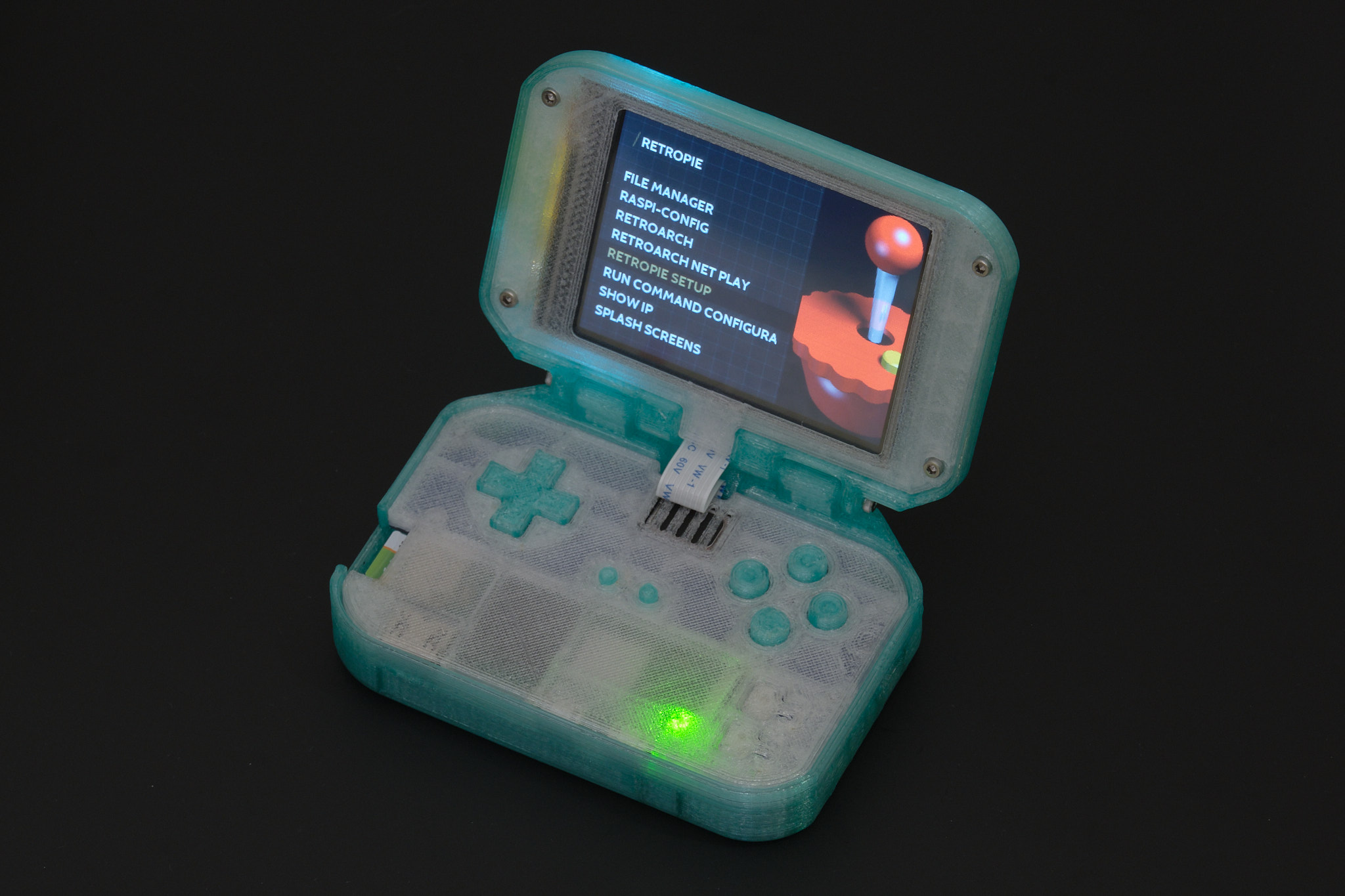 Pi Tin is an open source retro gaming device designed around the Raspberry Pi Zero 2 W and a 2.8” 320x240 TFT display, the largest readily available